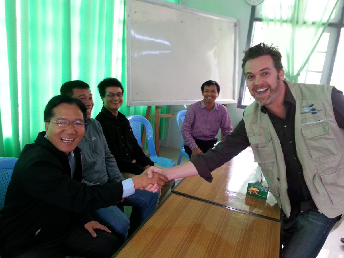 Chin Peace and Tranquility Chairman with Nonviolent Peaceforce's Paul Fraleigh at End of Training Ceremony. 