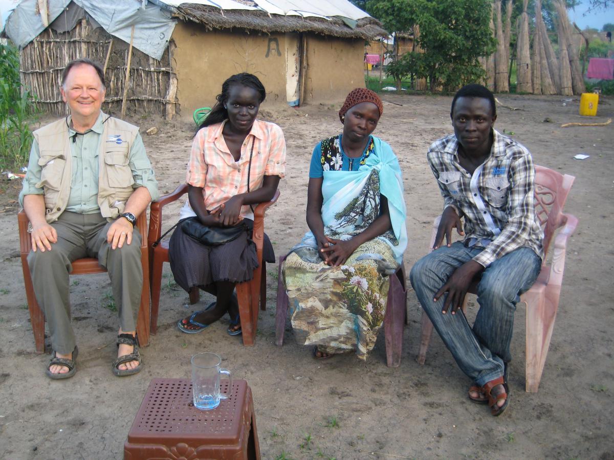 NP peacekeepers Mel , Lorech, and Johnson meet with Mary (in light blue)