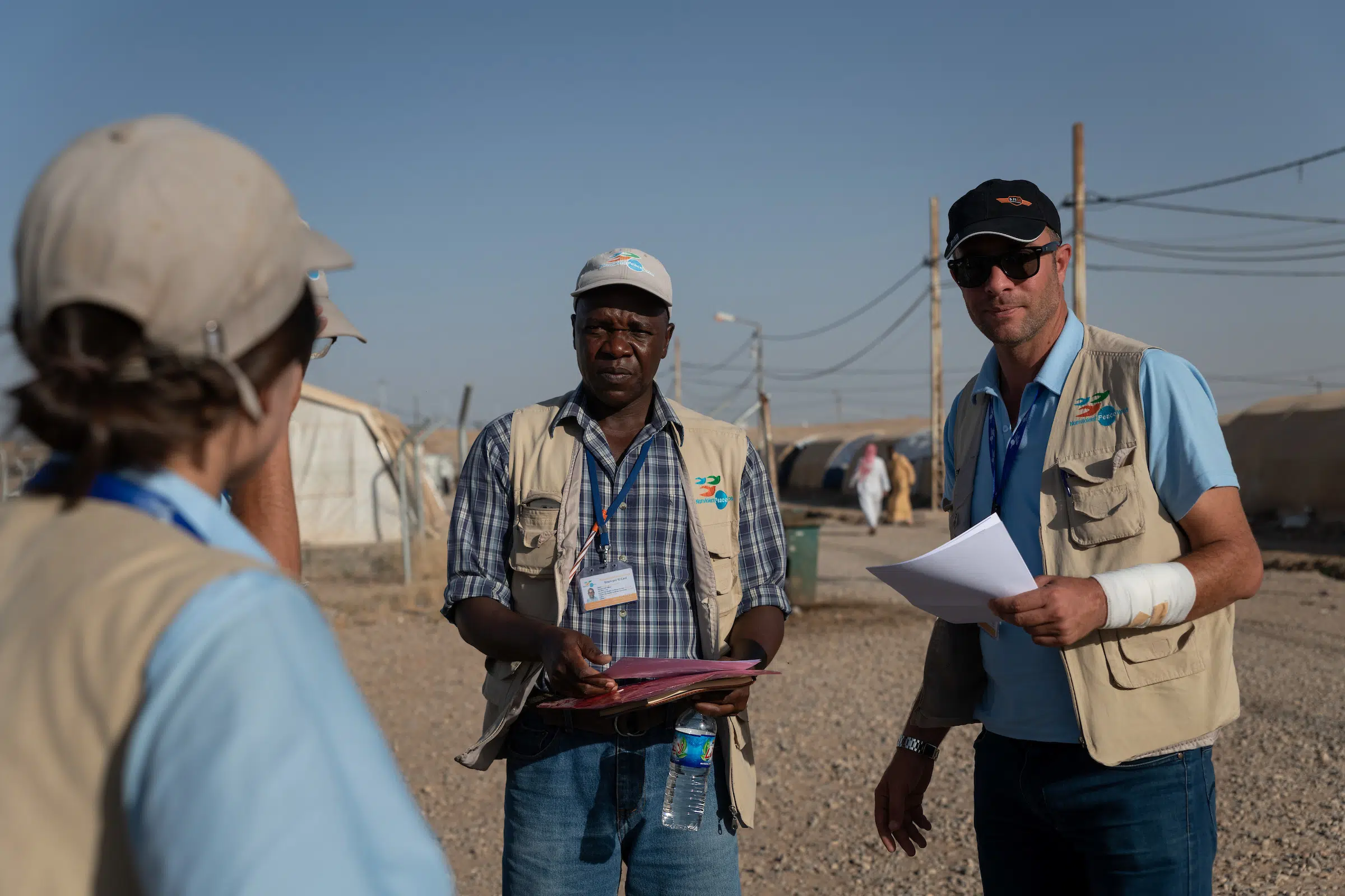 Nonviolent Peace Force protection officers visit Hamam al Alil camp during an afternoon patrol.