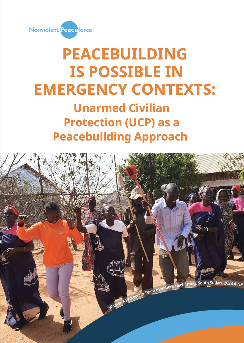Cover page of a Nonviolent Peaceforce issue briefing titled “Peacebuilding Is Possible in Emergency Contexts: Unarmed Civilian Protection (UCP) as a Peacebuilding Approach.” The top half features the title in orange text on a white background. Below, a group of Women’s Protection Team members in South Sudan are celebrating outdoors—smiling, dancing, and raising their hands and sticks in the air. The Nonviolent Peaceforce logo appears at the top left, and a curved blue and orange design runs along the bottom edge.