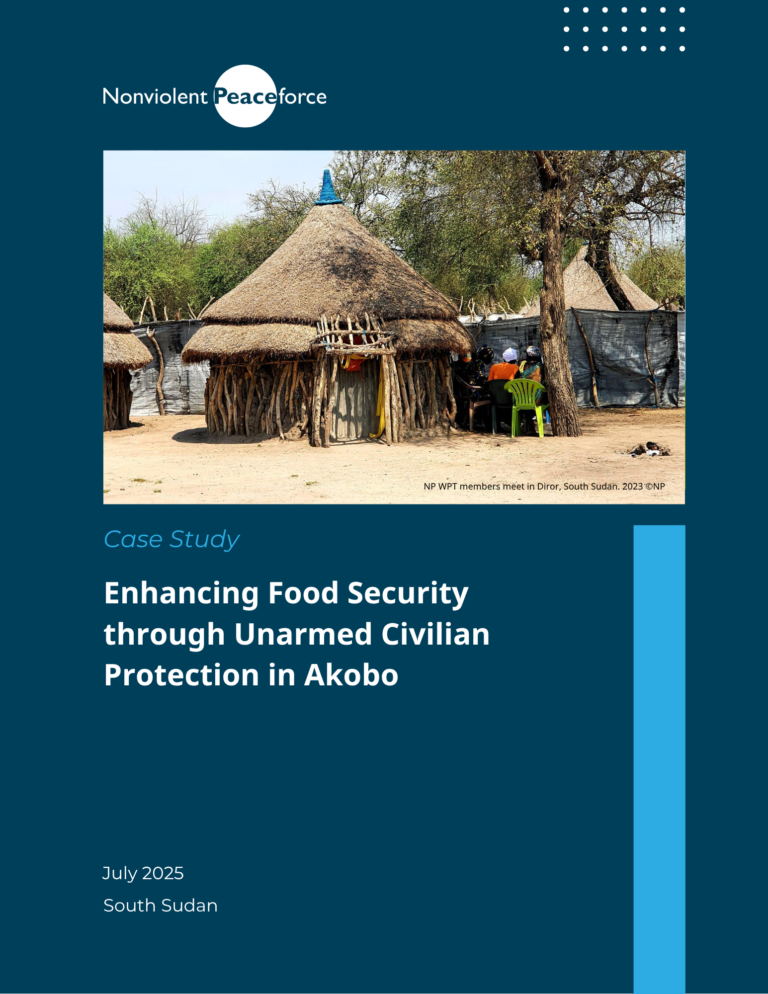 A photo of several traditional thatched huts in Diror, South Sudan, surrounded by trees and fencing. A small group of people, including WPT (Women’s Protection Team) members, sit in plastic chairs under a tree in conversation. The image is featured on a Nonviolent Peaceforce case study cover on a dark blue background. The case study is titled: "Enhancing Food Security through Unarmed Civilian Protection in Akobo", dated July 2025, South Sudan.