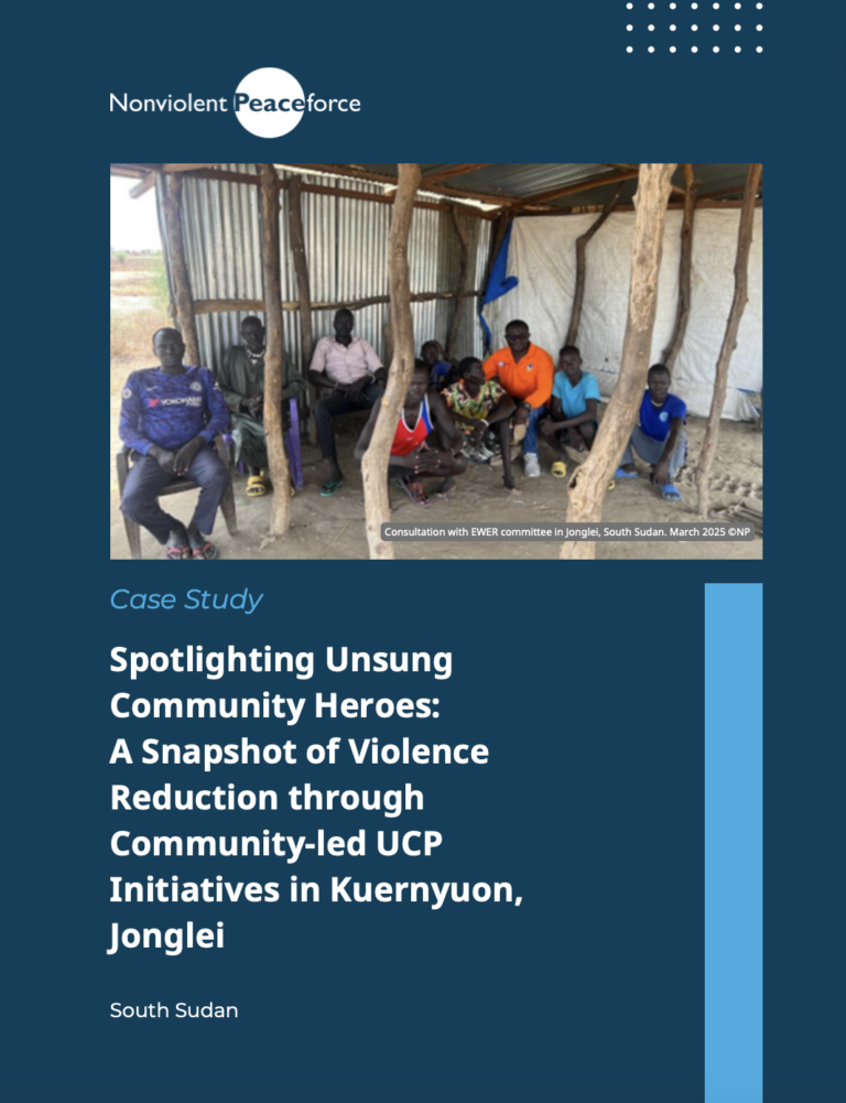 A group of men and boys sit together inside a simple, open-walled structure made of wooden poles and corrugated metal in Jonglei, South Sudan. The photo appears at the top of a case study cover titled “Spotlighting Unsung Community Heroes: A Snapshot of Violence Reduction through Community-led UCP Initiatives in Kuernyuon, Jonglei,” published by Nonviolent Peaceforce. A caption notes this was a consultation with an Early Warning, Early Response (EWER) committee in March 2025