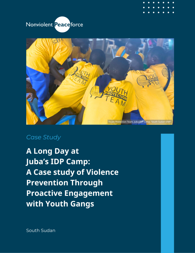 A group of youth wearing bright yellow “Youth Protection Team” t-shirts gather closely together at Juba’s IDP camp in South Sudan. The image appears on the cover of a Nonviolent Peaceforce case study titled, “A Long Day at Juba’s IDP Camp: A Case Study of Violence Prevention Through Proactive Engagement with Youth Gangs.”