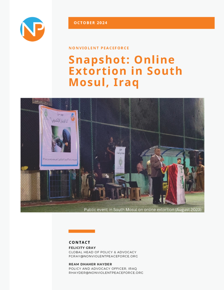 Cover page of Snapshot on Extortion in South Mosul, Iraq - title shown with an image from Iraq of a public event, a man stands at a podium with a banner behind him